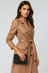 Elegant camel belted wool coat for women with black clutch – chic fall fashion outfit
