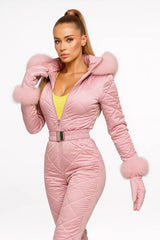 Women's pink quilted jumpsuit with fur hood and matching gloves – chic luxury winter outfit