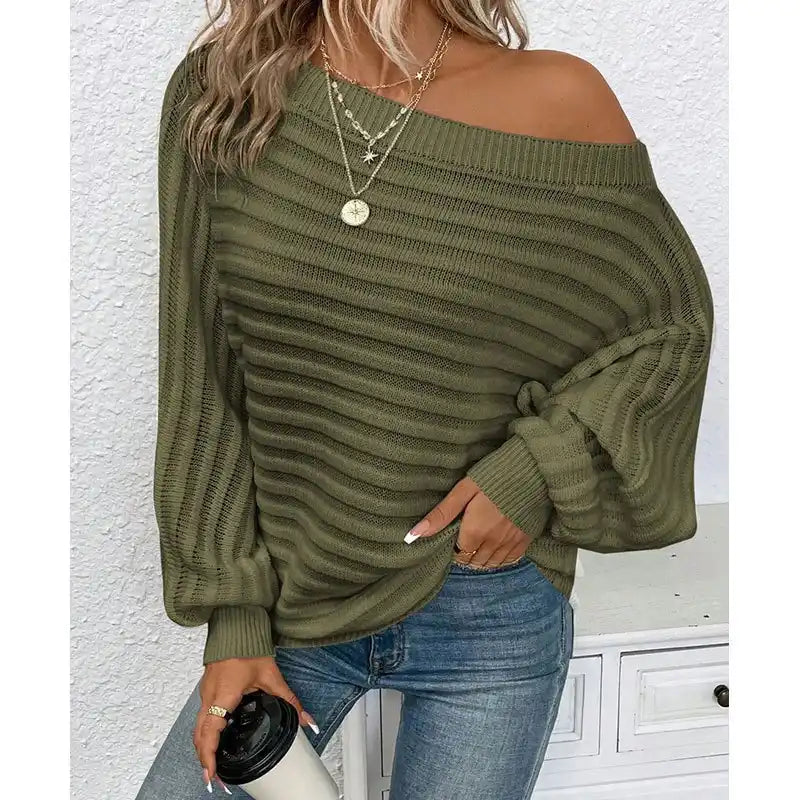 woman wearing a pink off-shoulder ribbed sweater styled with denim for a casual chic look